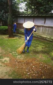 Two people cleaning a garden, Kenrokuen Garden, Kanazawa, Ishikawa Prefecture, Japan