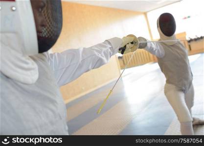 two people in fencing combat