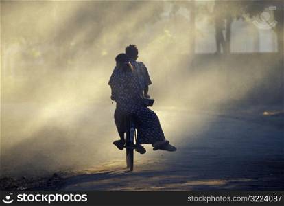Two People Riding a Bike