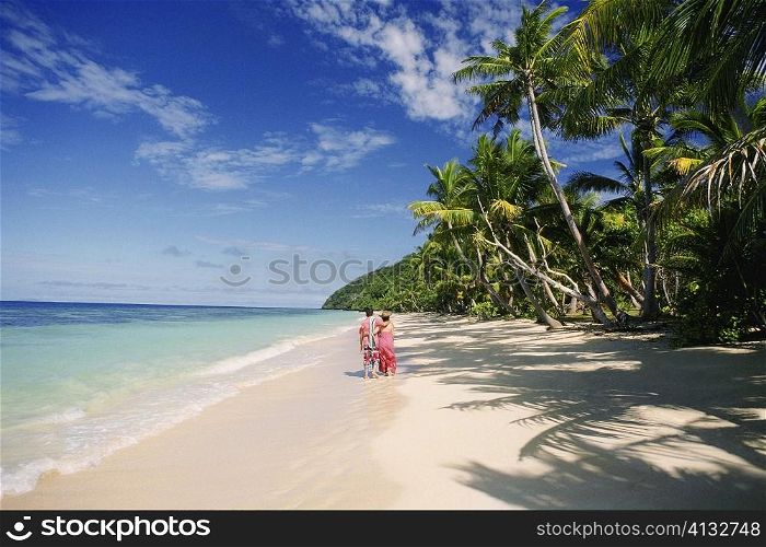 Two people standing on the beach, Fiji