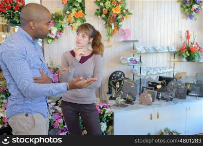 two people talking at a funeral-home