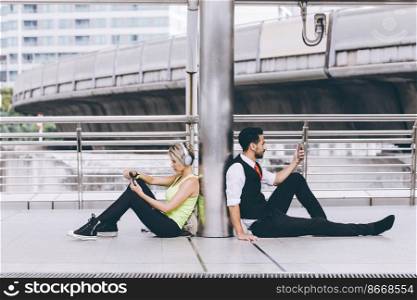 Two people with unique difference lifestyle compare both sport girl and businessman using smartphone.