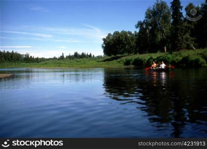Two persons rowing in the lake in Alaska