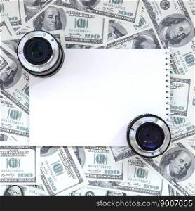 Two photographic lenses and white notebook lie on the background of a lot of dollar bills. Space for text