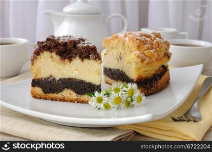 Two piece of cake with cheesecake filling poppy