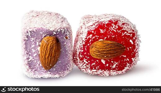 Two pieces of Turkish Delight with almonds beside isolated on white background