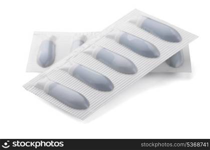 Two plastic packs of suppositories isolated on white