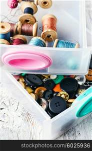 Two plastic sewing box with threads and buttons.Selective focus. Set of sewing kit