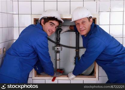 two plumbers resting after work