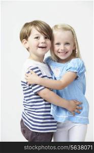 Two Pre School Pupils Hugging One Another