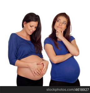 Two pregnant women dressed in blue isolated on white background