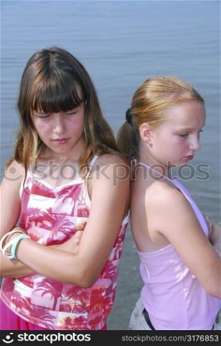Two preteen girls pouting