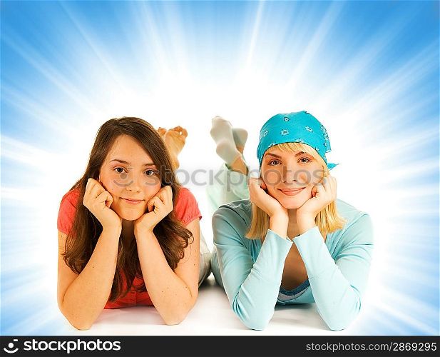 Two pretty teenage girls isolated on abstract background