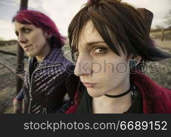 Two punk girls posing in a rural setting