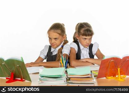 Two quarreling girls at the same desk