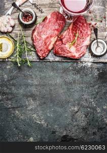 Two raw fillet steaks for grill,BBQ or frying with herbs and spices on rustic background, top view, place for text. Meat food. Argentinian steak