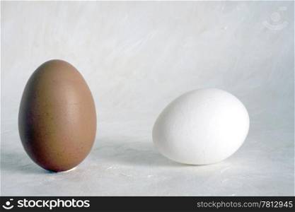 Two red and white eggs isolated on painted background