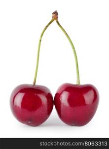 Two red cherries on handle isolated on white background. Two red cherries on handle