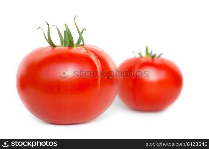 Two red fresh tomatoes isolated on white background