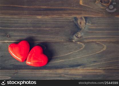 two red heart on wood table background with copy space