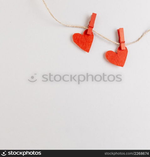 two red hearts string with pins