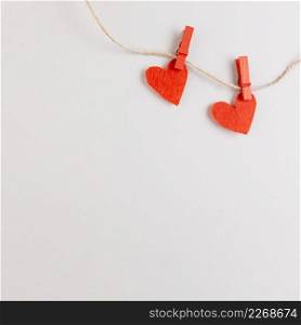 two red hearts string with pins