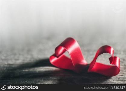 Two red ribbon hearts on wooden backround, Valentine day concept