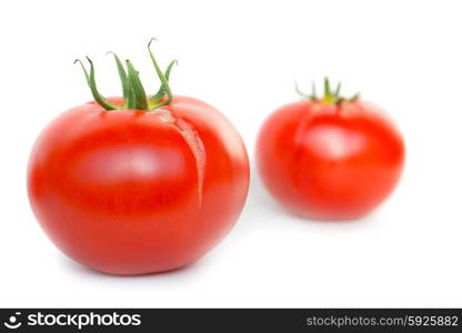 Two red ripe tomatoes isolated on white background