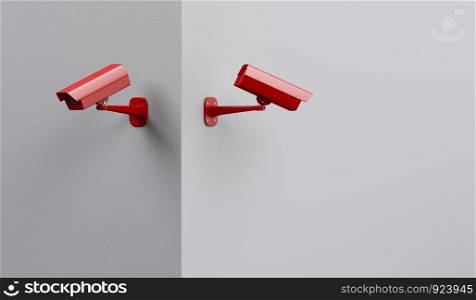 Two red security cameras on the wall