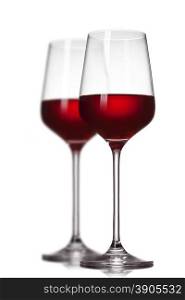 Two red wine glasses isolated on white