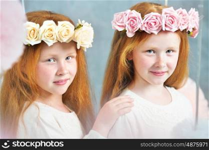 Two redhead twin sisters posing together