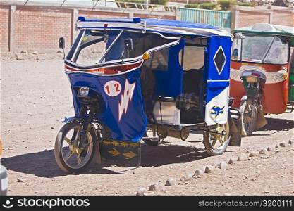 Two rickshaw parked on a dirt road, Chivay, Arequipa, Peru