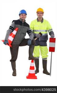two road workers posing together