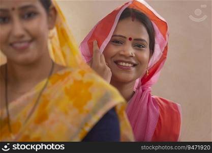Two rural women smiling.