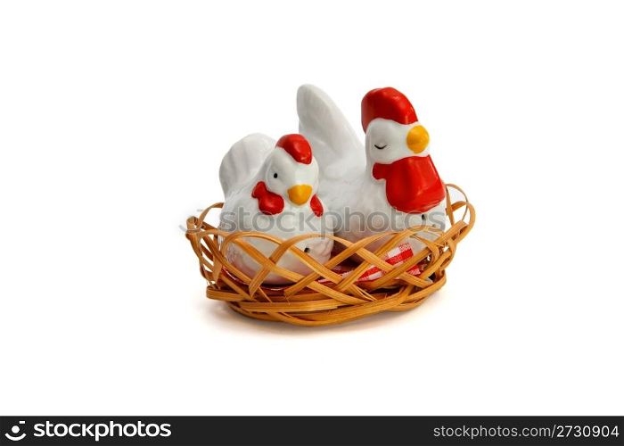 Two Russian porcelain souvenir saltsellars in shape of hens in the nest isolated