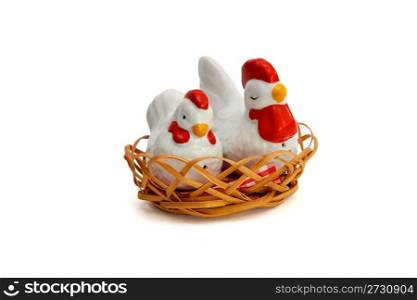 Two Russian porcelain souvenir saltsellars in shape of hens in the nest isolated