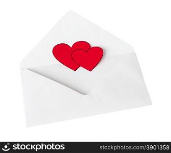Two scarlet heart in a white envelope on the white background