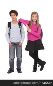 Two school children wearing backpacks