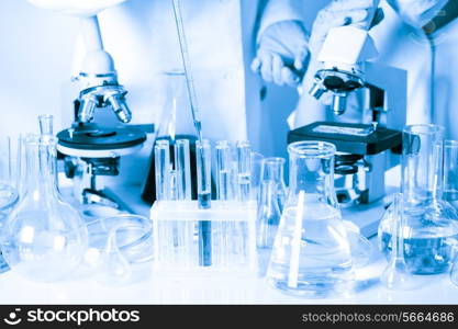 Two scientists in the chemical laboratory are doing experiments