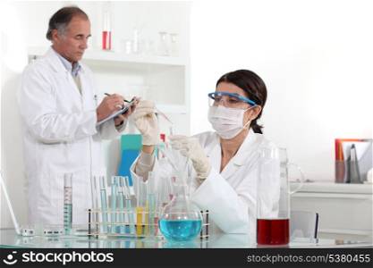 Two scientists working in laboratory