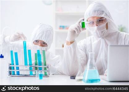 Two scientists working in the chemical lab