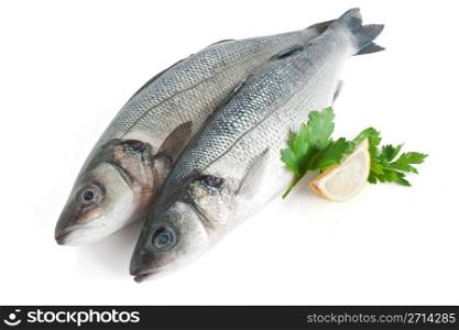 two sea bass with lemon and parsley isolated on white with clipping path