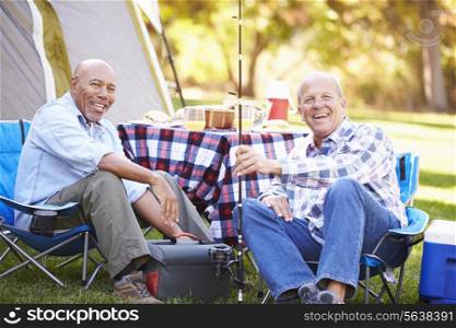 Two Senior Men On Camping Holiday With Fishing Rod
