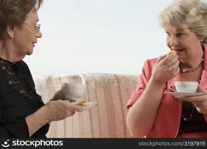 Two senior woman having breakfast