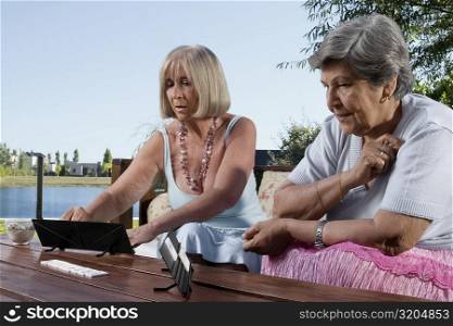 Two senior women playing games
