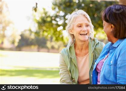 Two Senior Women Talking Outdoors Together