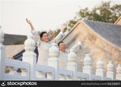 Two seniors practicing Taijiquan in Beijing, Arms outstretched