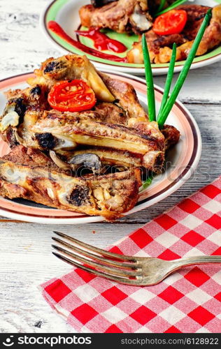 Two servings of roast beef,decorated with vegetables on decorated table