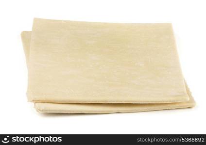 Two sheets of frozen puff pastry isolated on white