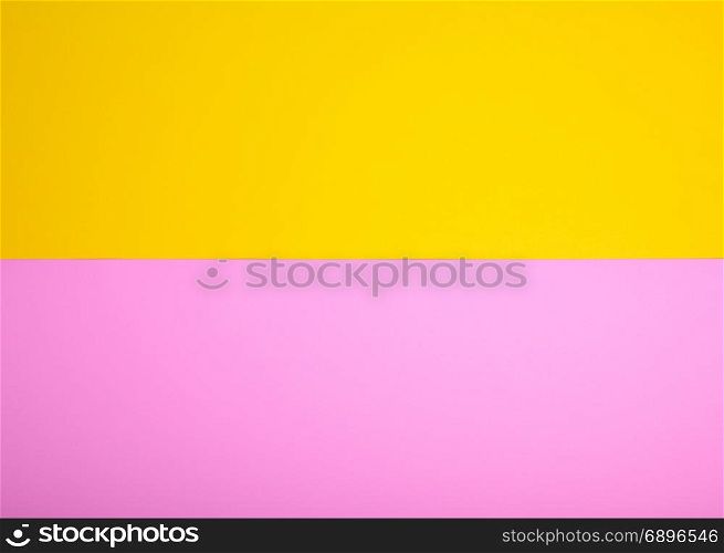 two sheets of paper, yellow and pink background